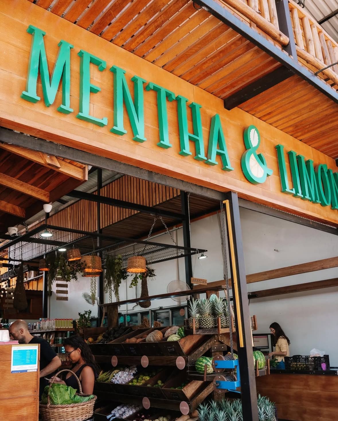 Mentha & Limon store interior with fresh produce displays and customers shopping
